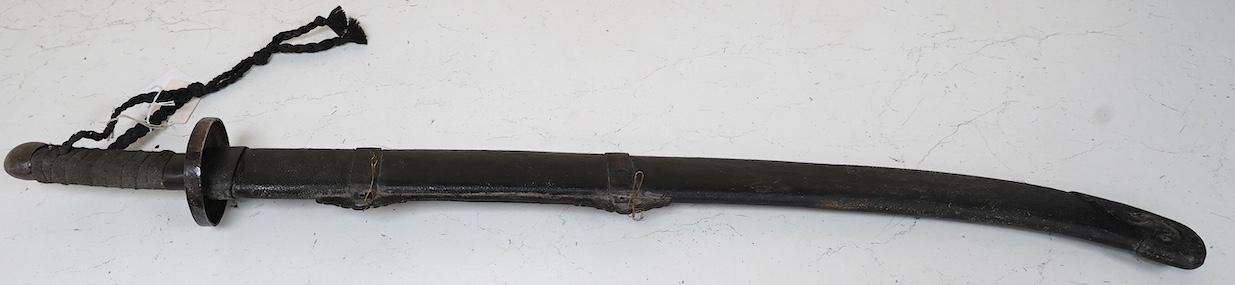 A Chinese Boxer Rebellion period sword, broad single edge blade, iron mounts, in its fish skin covered scabbard with iron mounts, blade 73.5cm. Condition - good